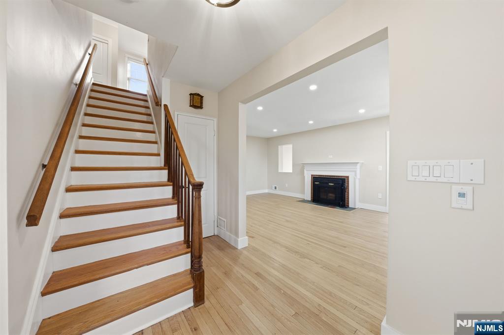25 Forest Street Closter, NJ 07624 - Photo 2 of 48 a view of a livingroom with wooden floor and stairs