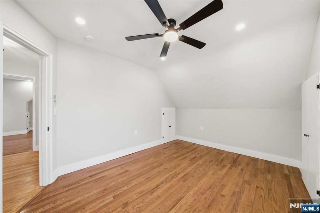 25 Forest Street Closter, NJ 07624 - Photo 24 of 48 an empty room with wooden floor fan and windows