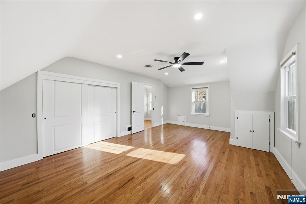 25 Forest Street Closter, NJ 07624 - Photo 29 of 48 a view of empty room with wooden floor and fan