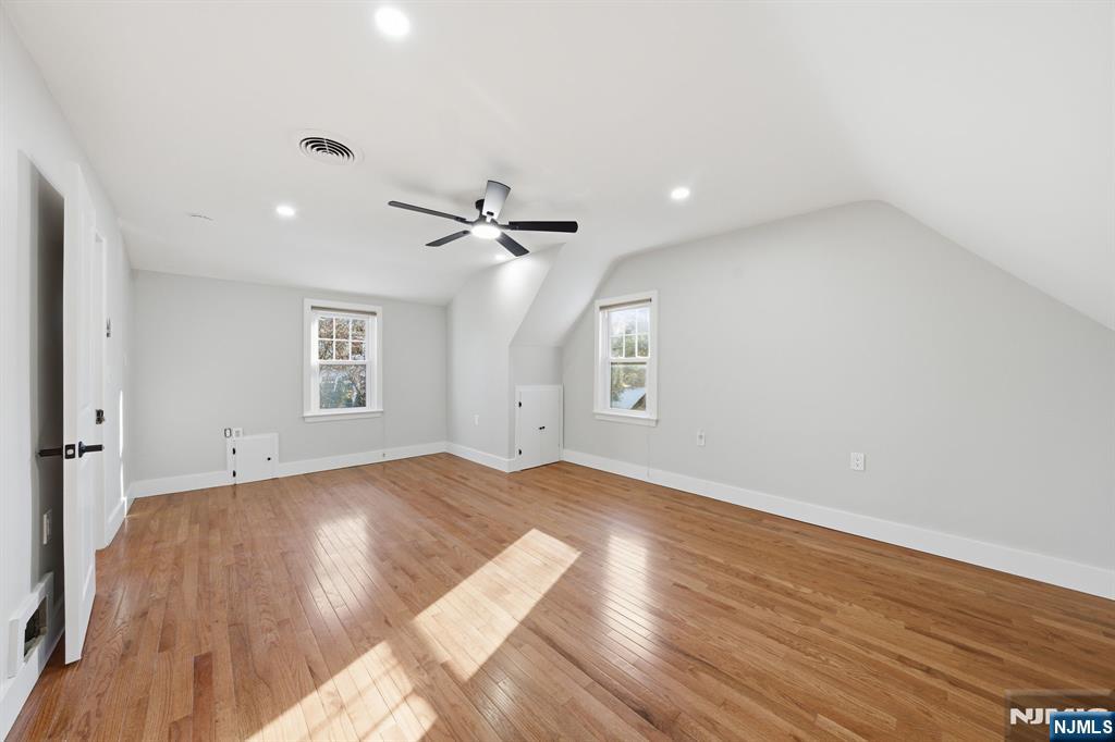 25 Forest Street Closter, NJ 07624 - Photo 30 of 48 a view of an empty room with a window and wooden floor