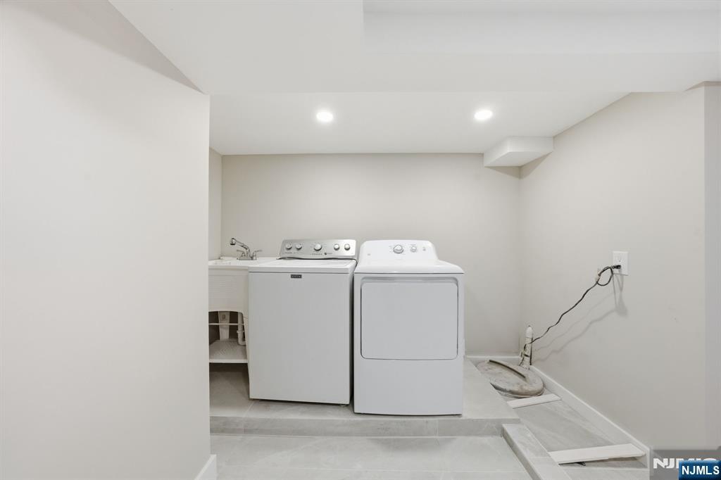 25 Forest Street Closter, NJ 07624 - Photo 34 of 48 a utility room with dryer and washer