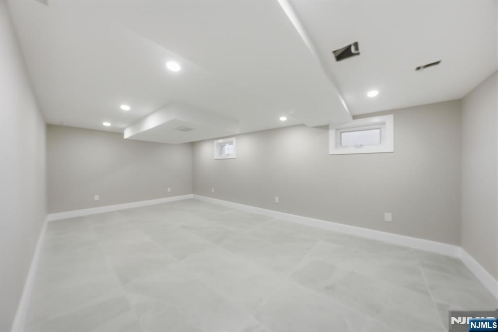 25 Forest Street Closter, NJ 07624 - Photo 40 of 48 an empty room with a empty space and window