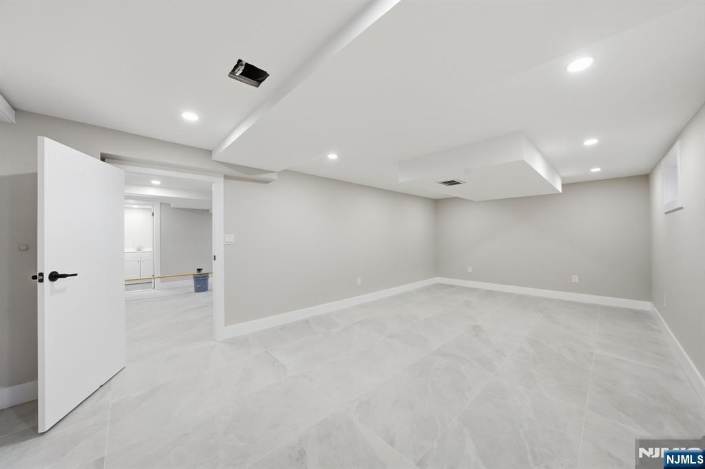 25 Forest Street Closter, NJ 07624 - Photo 41 of 48 an empty room with a empty space and windows