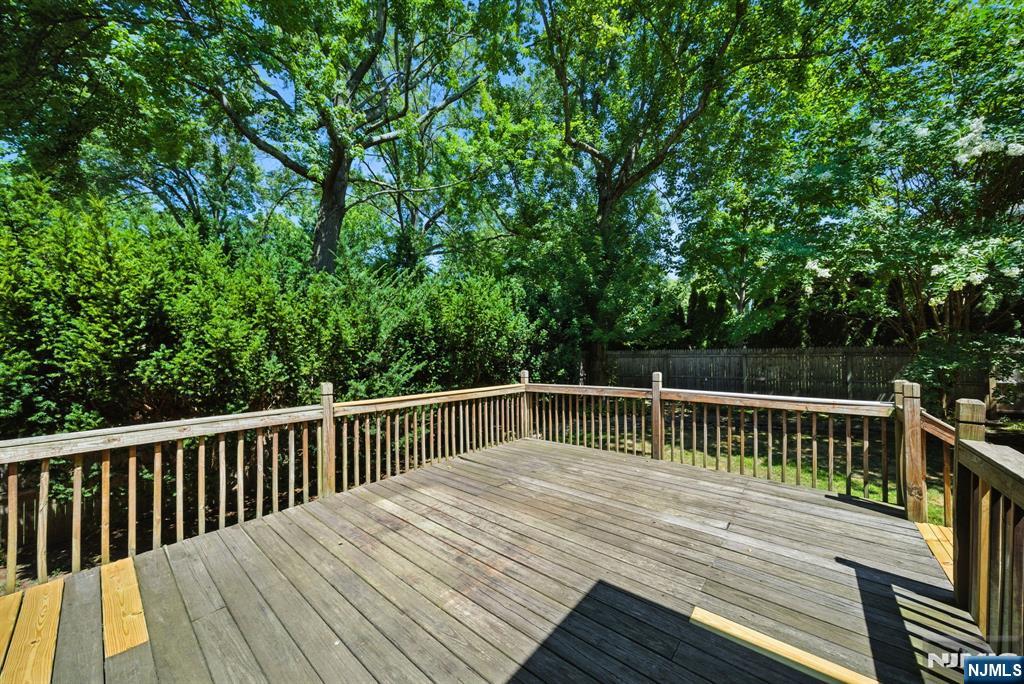 25 Forest Street Closter, NJ 07624 - Photo 44 of 48 a view of balcony with wooden floor and fence