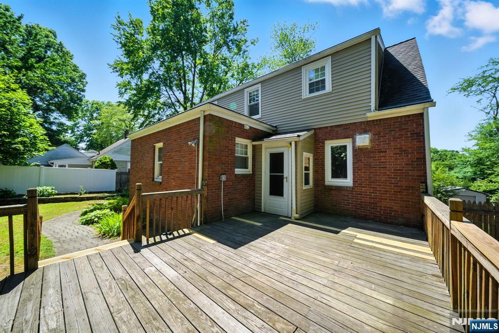 25 Forest Street Closter, NJ 07624 - Photo 45 of 48 a front view of a house with a porch