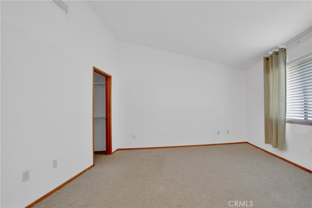 22544 Ojai Road Apple Valley, CA 92308 - Photo 12 of 20 an empty room with a empty space and window