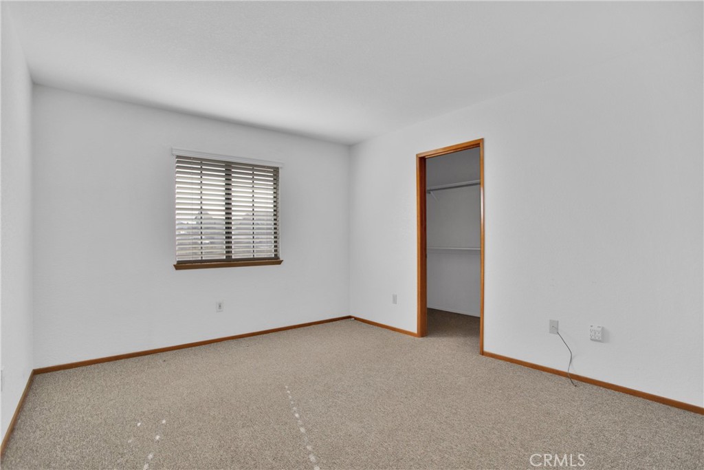 22544 Ojai Road Apple Valley, CA 92308 - Photo 8 of 20 an empty room with windows