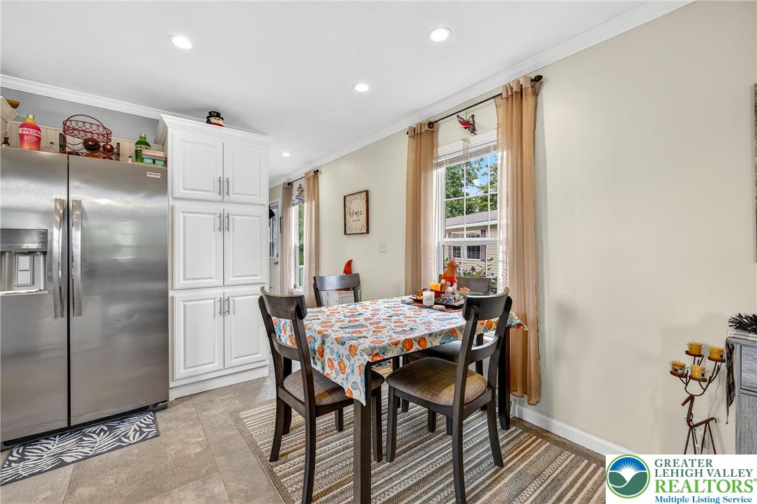 8792 Turkey Ridge Road Breinigsville, PA 18031 - Photo 12 of 33 a view of a dining room with furniture window and outside view