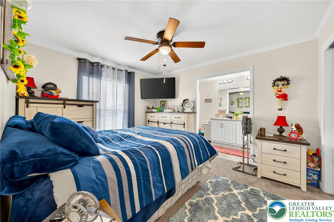 8792 Turkey Ridge Road Breinigsville, PA 18031 - Photo 18 of 33 a bedroom with a bed and wooden floor