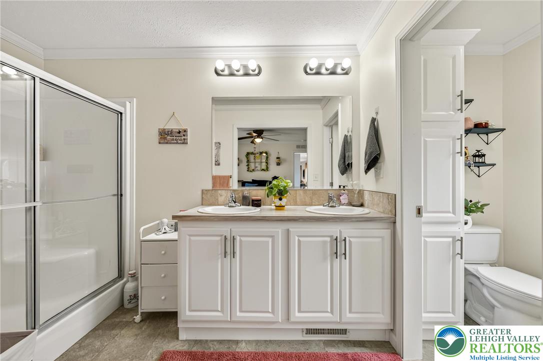 8792 Turkey Ridge Road Breinigsville, PA 18031 - Photo 20 of 33 a bathroom with a sink and a mirror