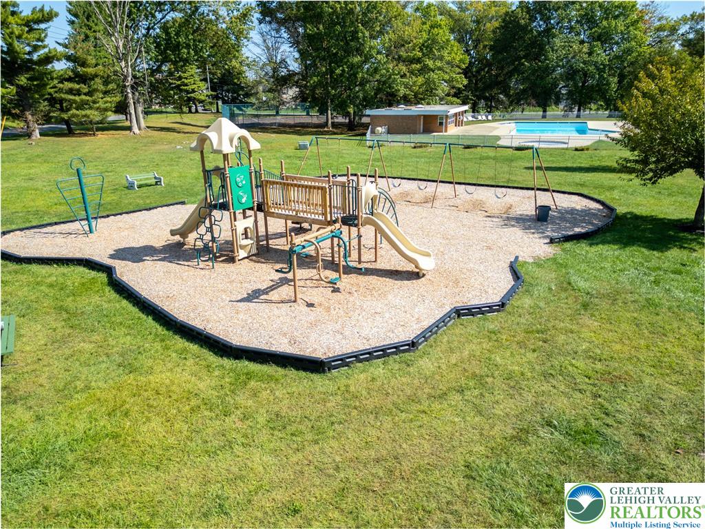 8792 Turkey Ridge Road Breinigsville, PA 18031 - Photo 30 of 33 a view of a swimming pool with a slide
