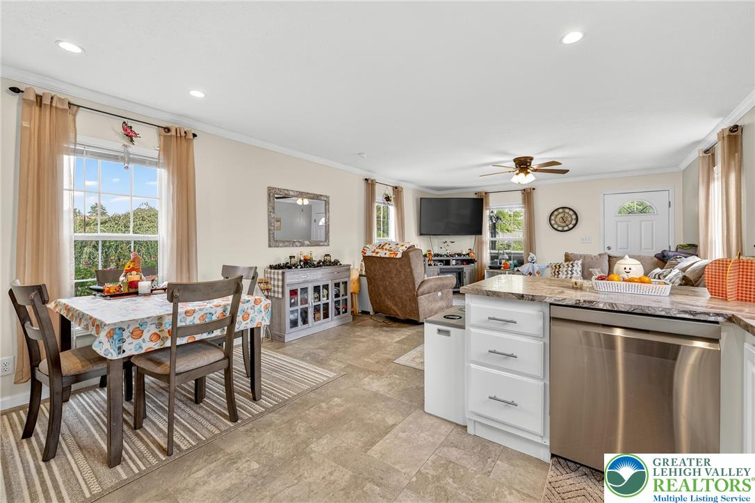 8792 Turkey Ridge Road Breinigsville, PA 18031 - Photo 10 of 33 a living room with furniture a rug and a window
