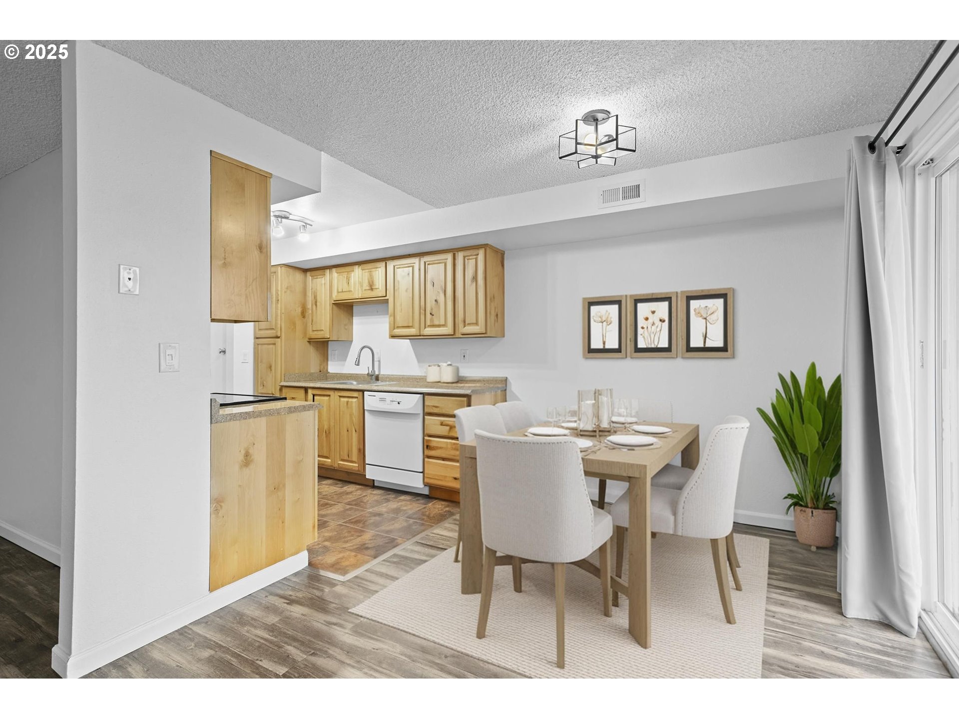 311 Northeast 85th Street, Unit R Vancouver, WA 98665 - Photo 9 of 34 a view of a dining room with furniture and a kitchen