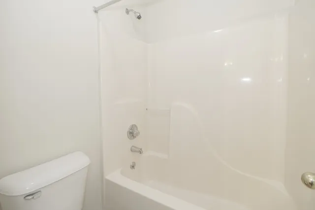 a kitchen with a stove a sink and a microwave