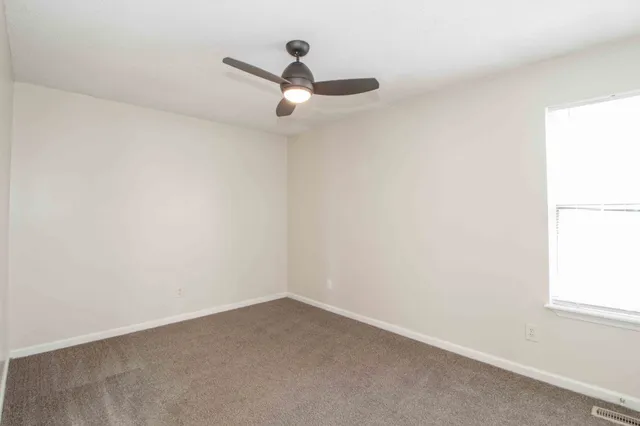 an empty room with a empty space and window