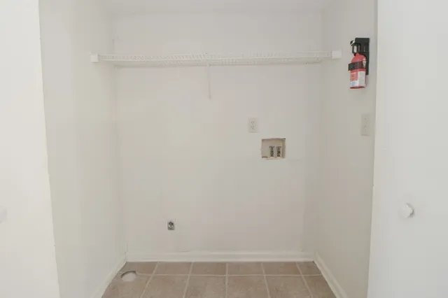 a view of a livingroom with a chandelier fan