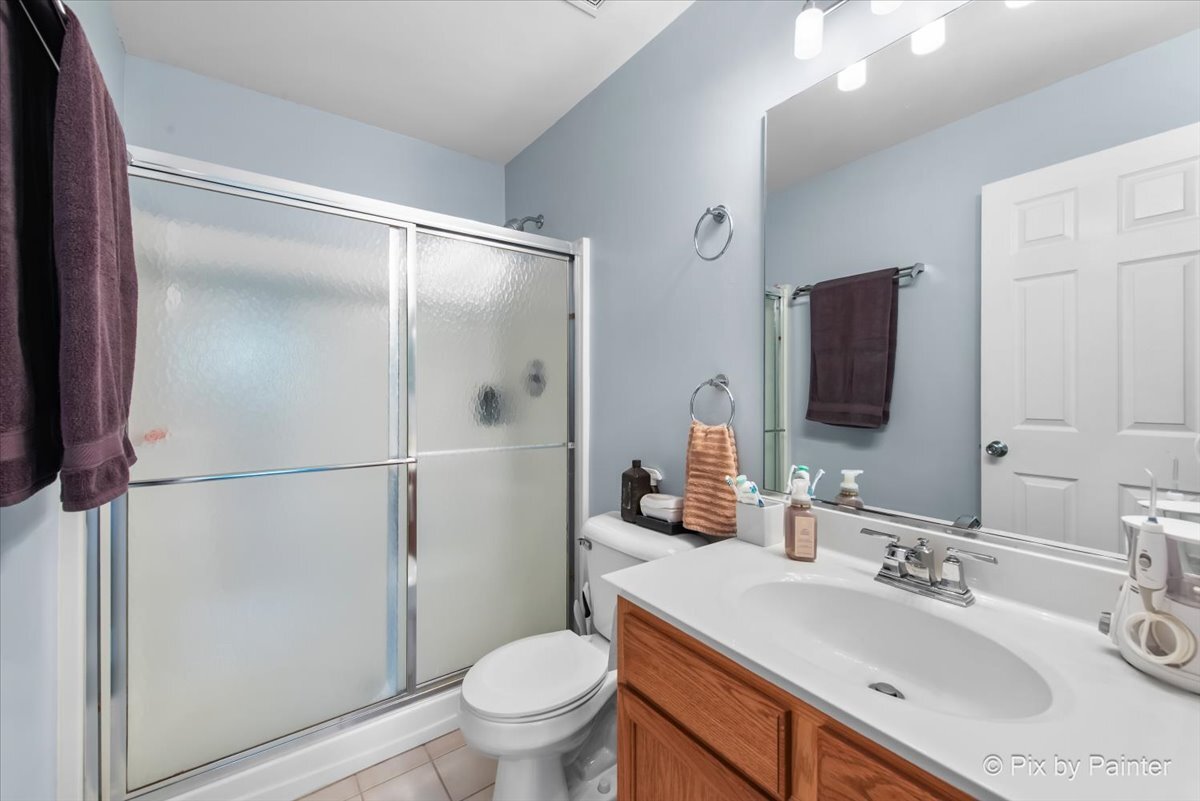 2138 Vanderbilt Drive Geneva, IL 60134 - Photo 11 of 18 a bathroom with a sink toilet and shower