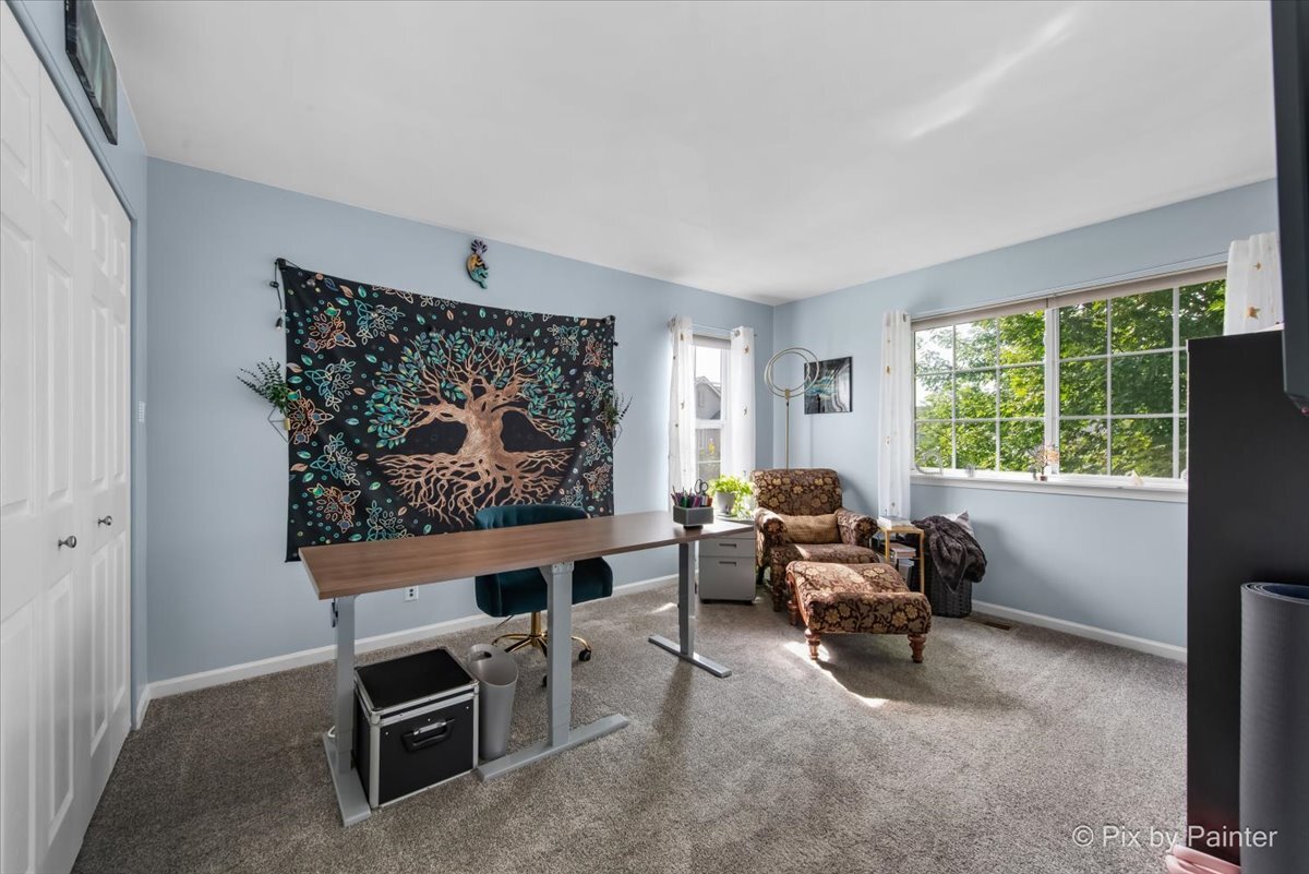 2138 Vanderbilt Drive Geneva, IL 60134 - Photo 13 of 18 a living room with furniture a rug and a large window