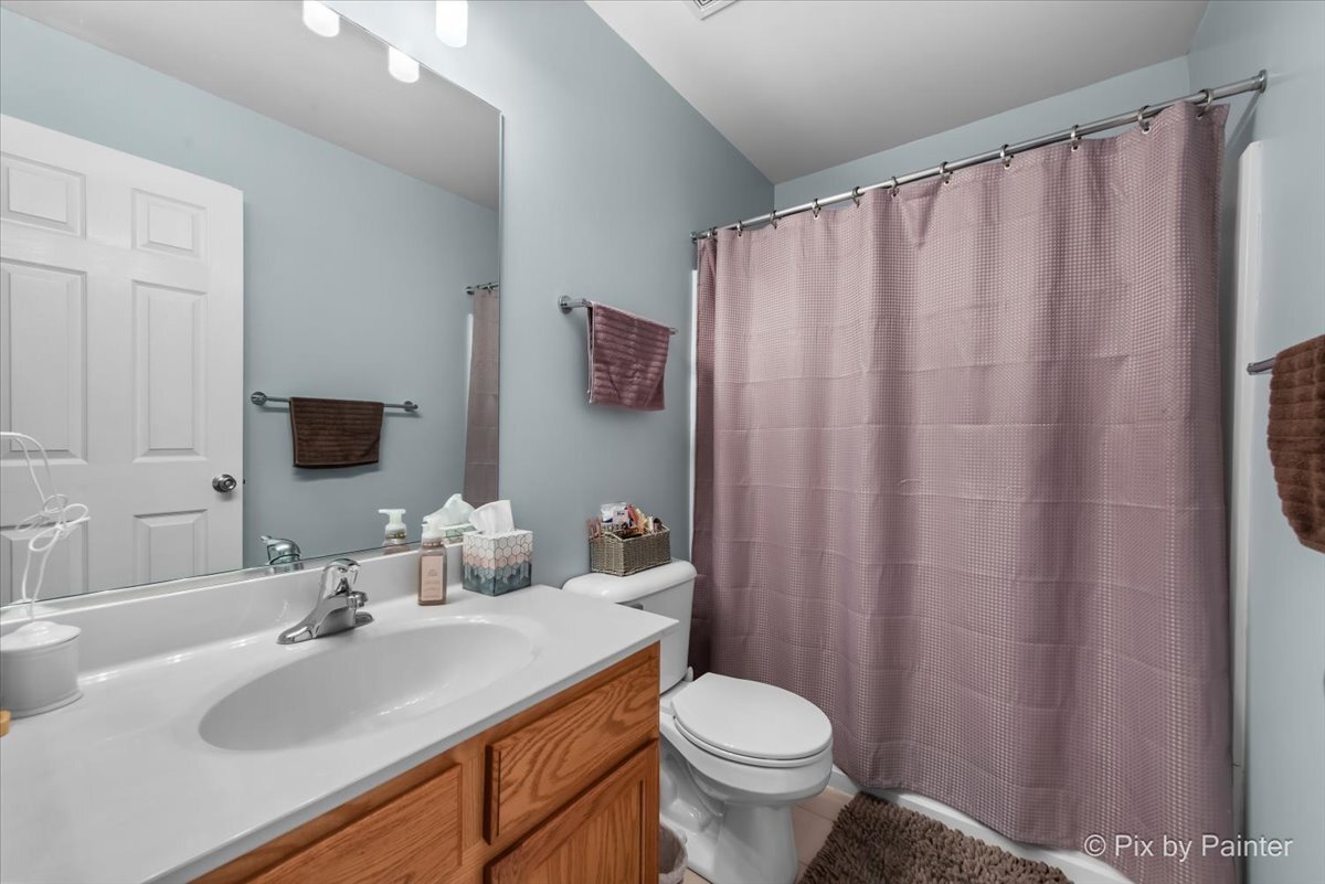 2138 Vanderbilt Drive Geneva, IL 60134 - Photo 14 of 18 a bathroom with a sink and a mirror