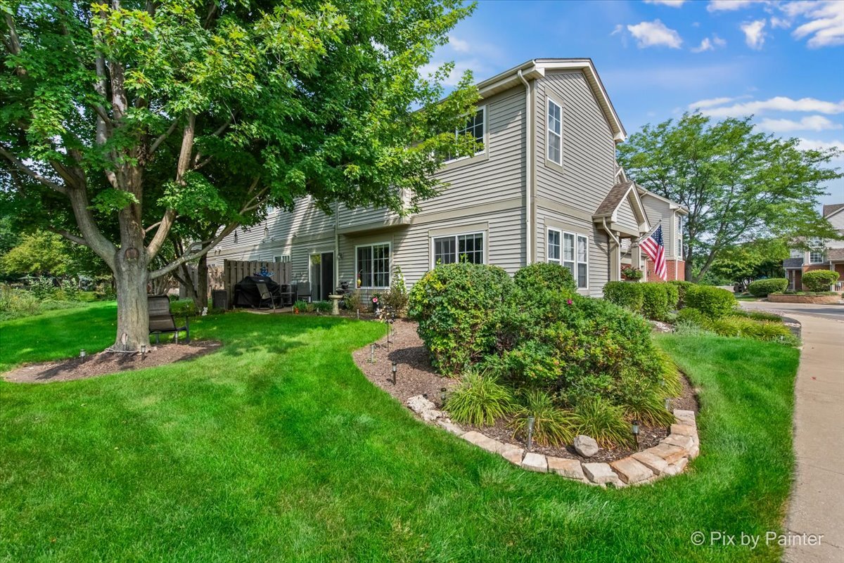 2138 Vanderbilt Drive Geneva, IL 60134 - Photo 15 of 18 a front view of a house with a yard