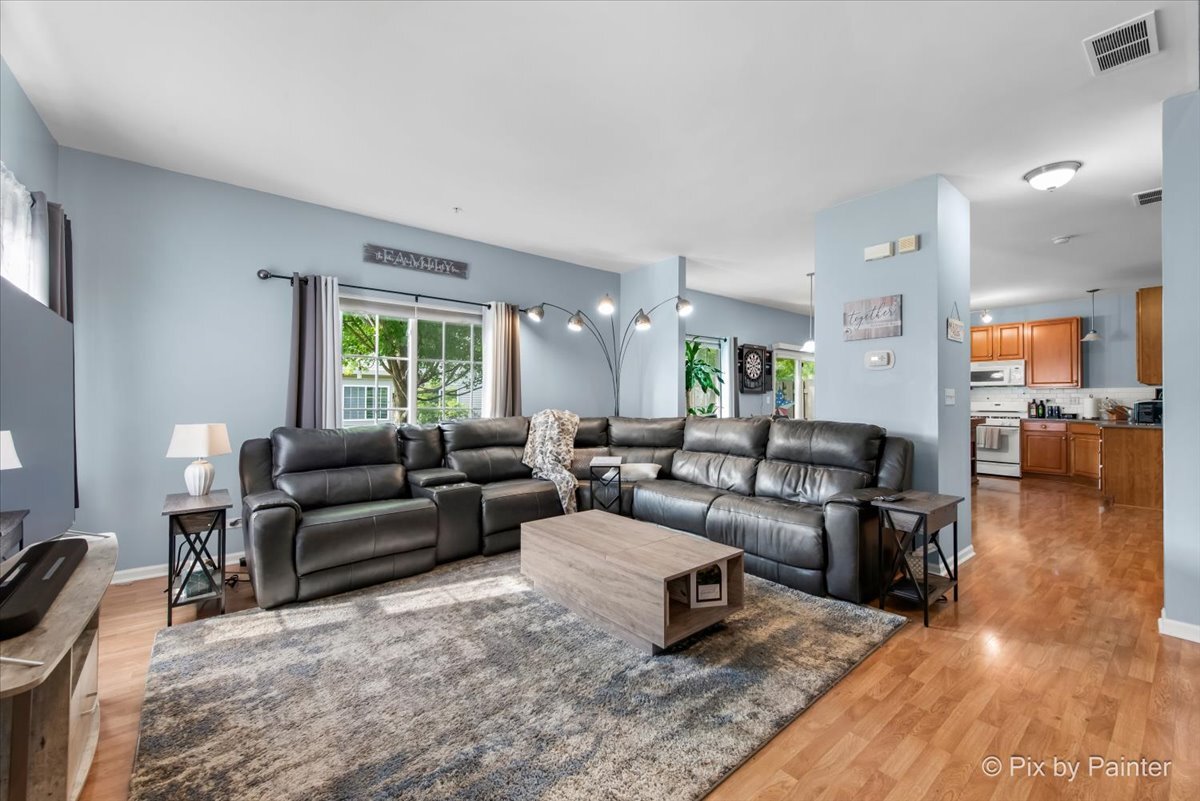 2138 Vanderbilt Drive Geneva, IL 60134 - Photo 2 of 18 a living room with furniture and a wooden floor