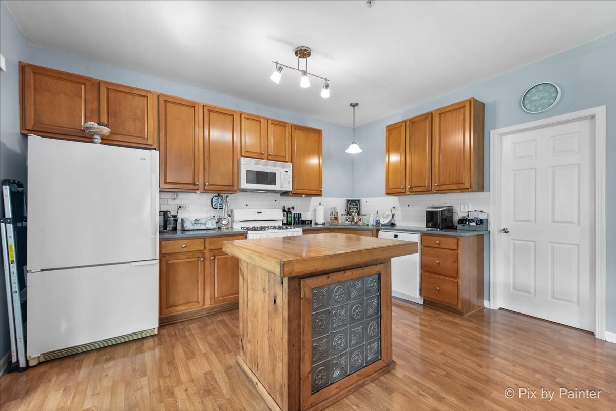 2138 Vanderbilt Drive Geneva, IL 60134 - Photo 6 of 18 a kitchen with stainless steel appliances granite countertop a refrigerator a stove a sink and a refrigerator