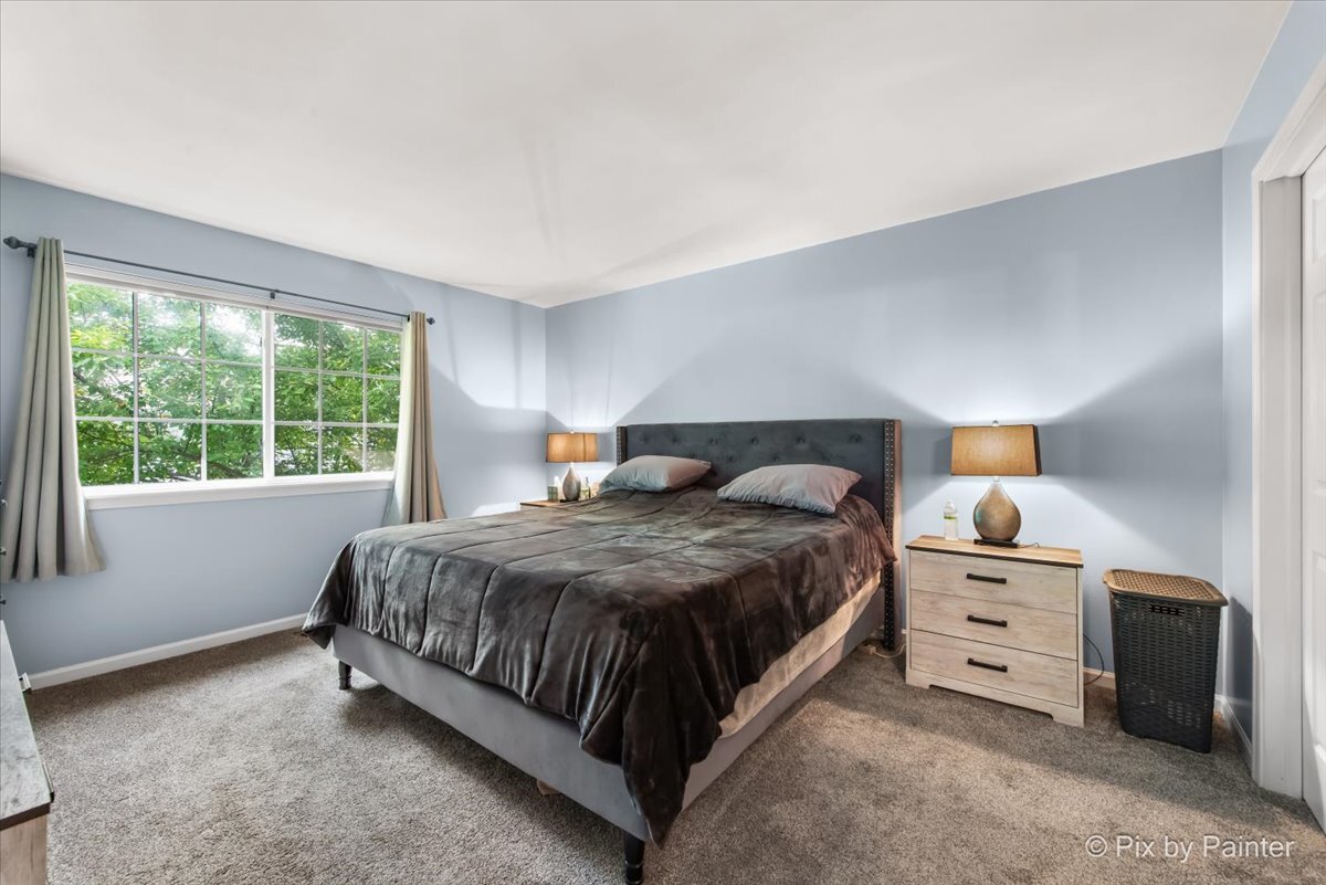 2138 Vanderbilt Drive Geneva, IL 60134 - Photo 9 of 18 a bedroom with a large bed and a window