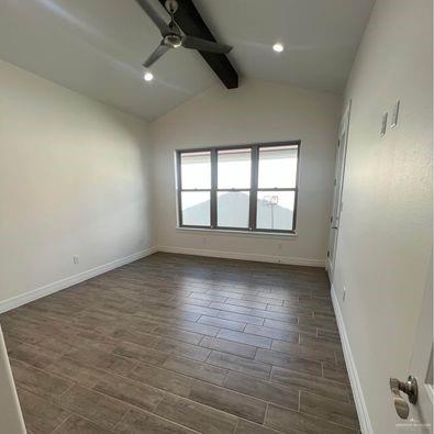 804 Grayson Avenue McAllen, TX 78504 - Photo 15 of 30 an empty room with wooden floor and windows