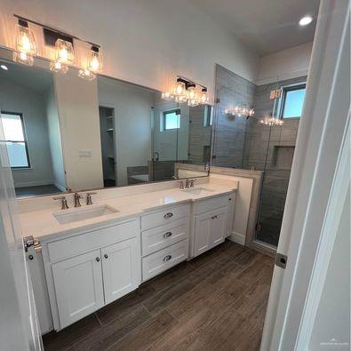 804 Grayson Avenue McAllen, TX 78504 - Photo 16 of 30 a spacious bathroom with double vanity sink a mirror and a shower