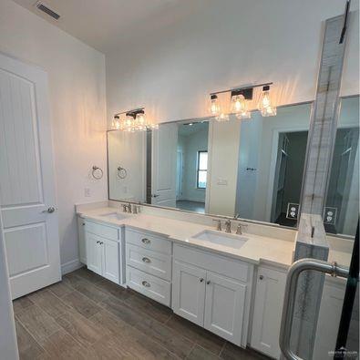 804 Grayson Avenue McAllen, TX 78504 - Photo 21 of 30 a bathroom with a double vanity sink and a mirror