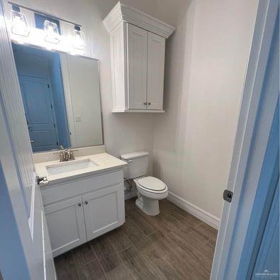 804 Grayson Avenue McAllen, TX 78504 - Photo 24 of 30 a bathroom with a toilet sink and mirror