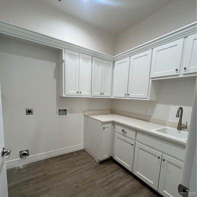 804 Grayson Avenue McAllen, TX 78504 - Photo 25 of 30 a view of cabinets a sink and wooden floor in a room
