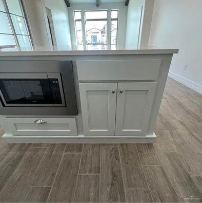 a view of a living room with a fireplace
