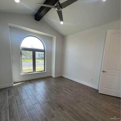 804 Grayson Avenue McAllen, TX 78504 - Photo 8 of 30 a view of empty room with wooden floor and fan