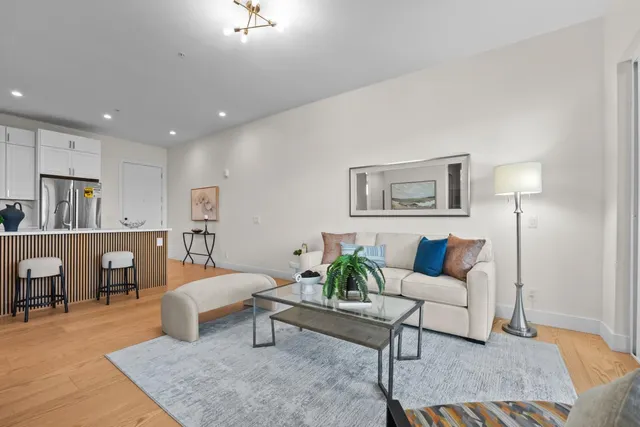 a living room with furniture and a table