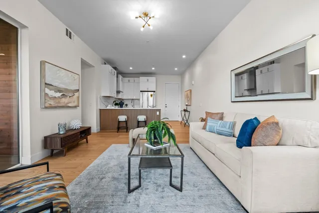 a living room with furniture and a rug