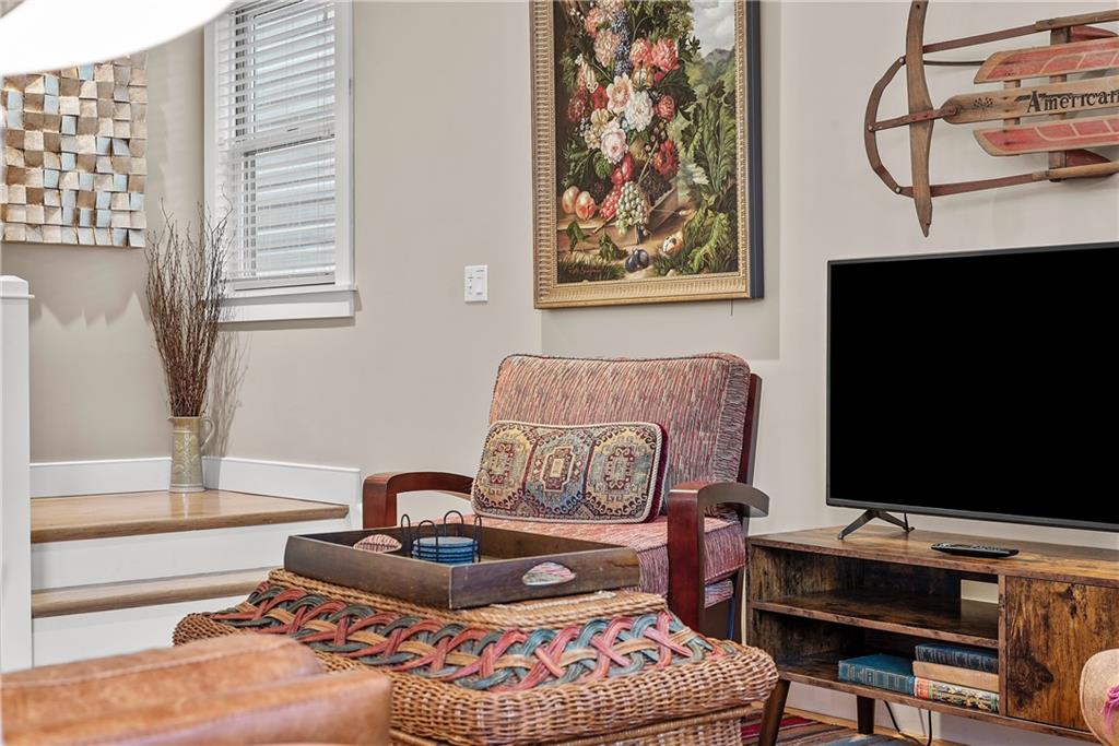 706 Ivy Street, Unit 2 Pittsburgh, PA 15232 - Photo 17 of 35 a bedroom with furniture and a flat screen tv
