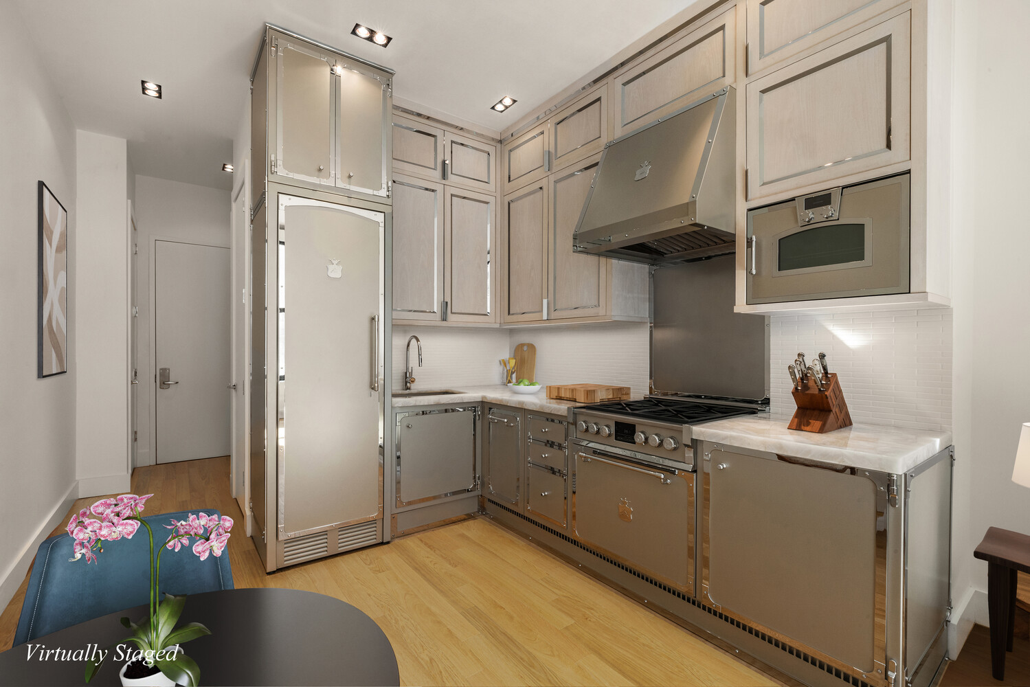 254 Park Avenue South, Unit 6G Manhattan, NY 10010 - Photo 4 of 6 a kitchen with stainless steel appliances granite countertop a sink stove and refrigerator