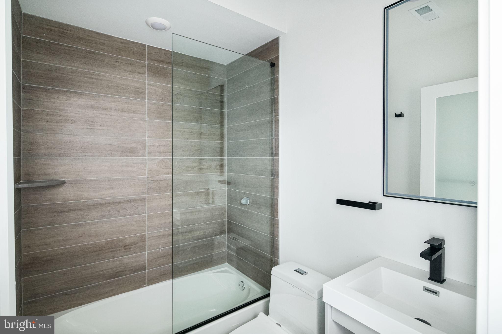 2607 East Boston Street, Unit 1 Philadelphia, PA 19125 - Photo 12 of 25 a bathroom with a shower and a sink
