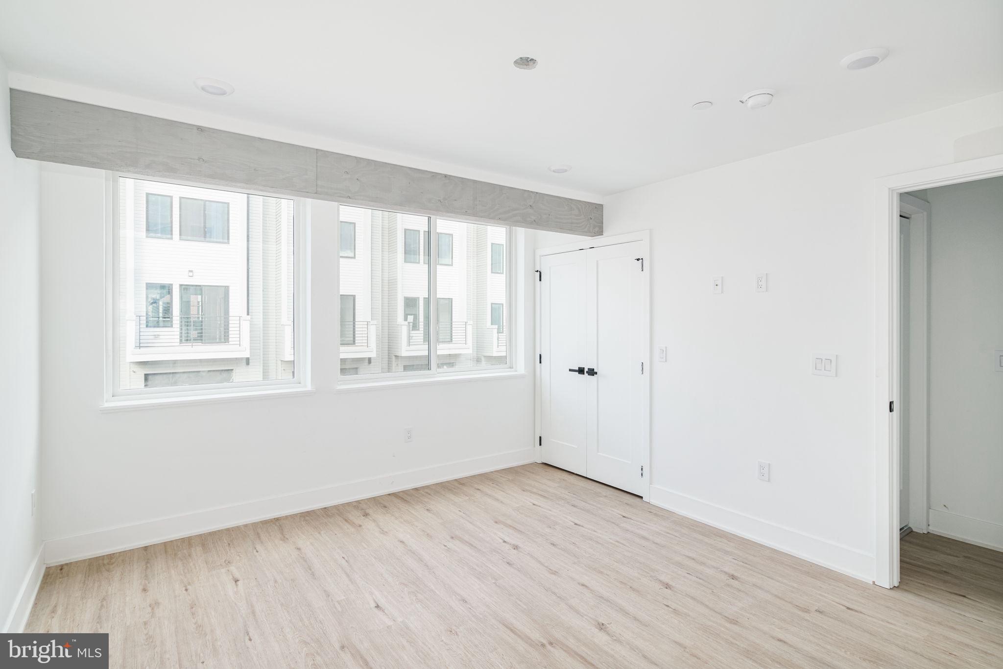 2607 East Boston Street, Unit 1 Philadelphia, PA 19125 - Photo 16 of 25 a view of an empty room with wooden floor and a window