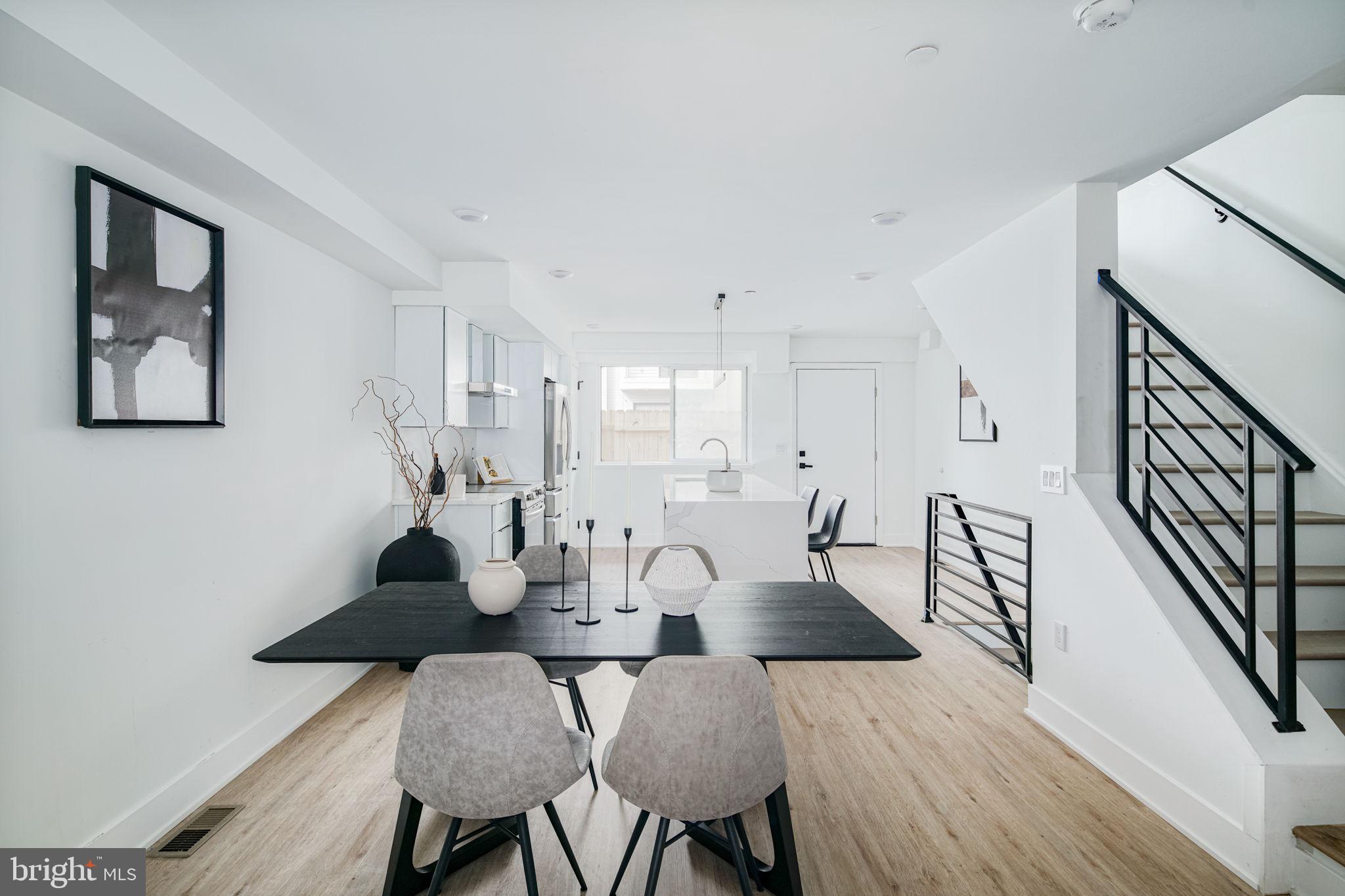 2607 East Boston Street, Unit 1 Philadelphia, PA 19125 - Photo 5 of 25 a view of a dining room with furniture and wooden floor