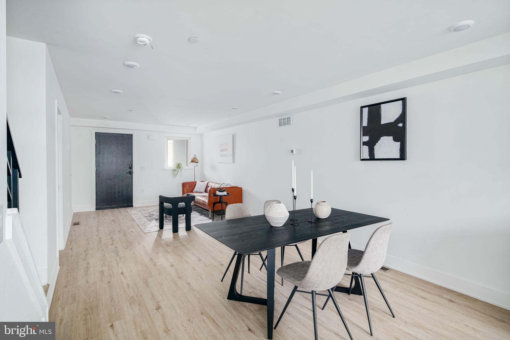 2607 East Boston Street, Unit 1 Philadelphia, PA 19125 - Photo 6 of 25 a view of a dining room with furniture and wooden floor