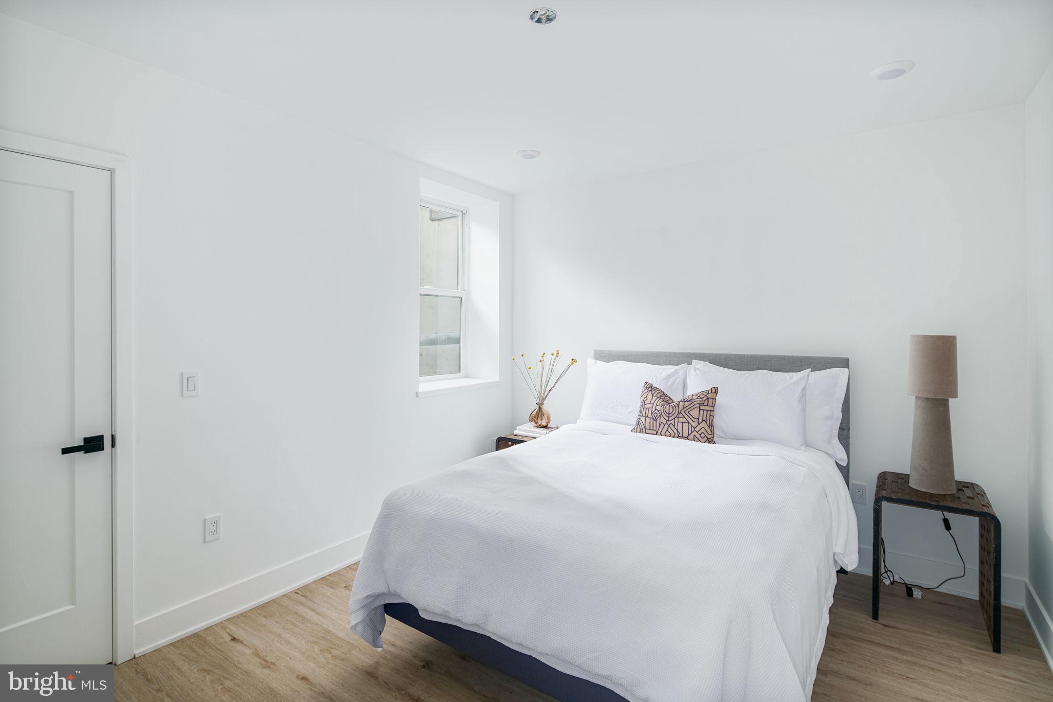 2607 East Boston Street, Unit 1 Philadelphia, PA 19125 - Photo 9 of 25 a bedroom with a bed and a window