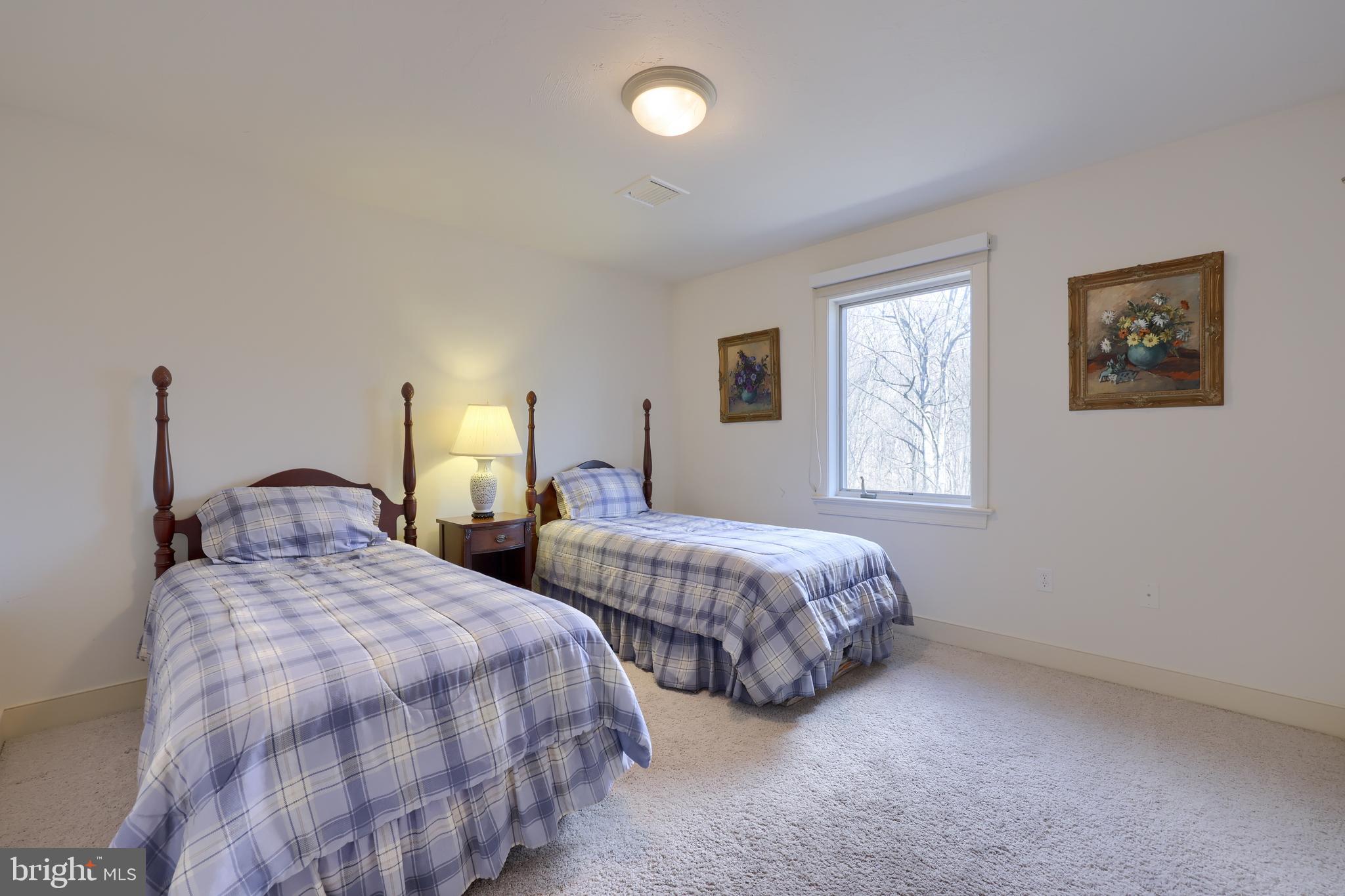 4495 Beards School Road Spring Grove, PA 17362 - Photo 27 of 57 a bedroom with two beds and a window