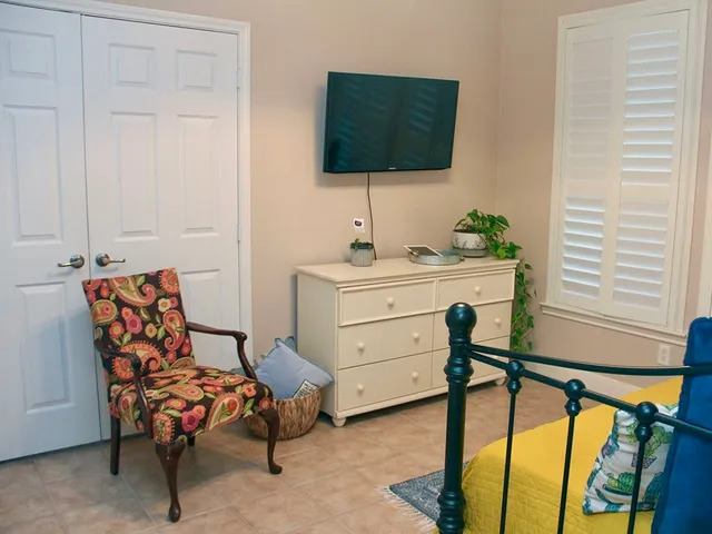 a reading room with furniture and lamp