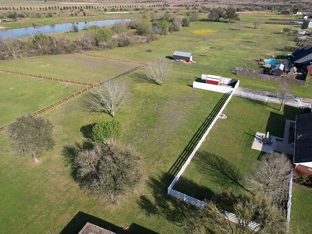 a view of a lake with a yard