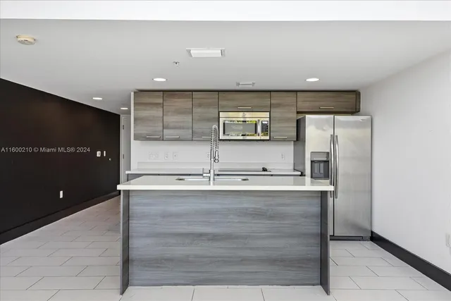 a view of a hallway with washer and dryer