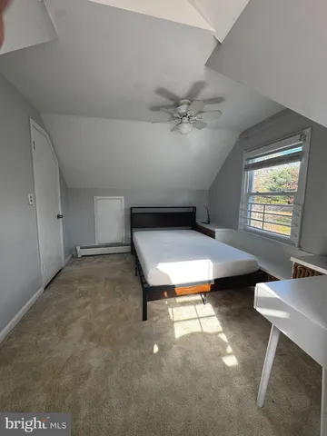 a room with pool table and windows