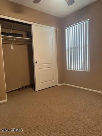 a view of a hallway with closet area