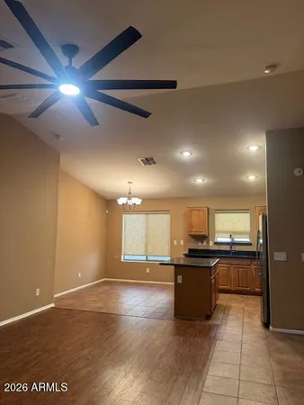 a kitchen with stainless steel appliances granite countertop a stove and cabinets